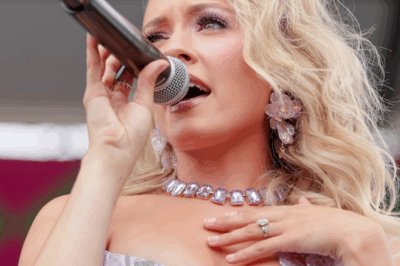 The country music star suffered a wardrobe malfunction when the top button of her outfit popped open, exposing her entire bust to the audience.