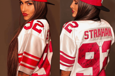 Nikki Bella’s Ultimate Betrayal! The WWE Star and die-hard Eagles fan was forced to commit the unthinkable act after losing a shocking bet to Michael Strahan. You have to see the photos.
