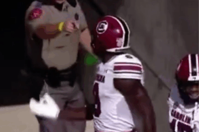 Shocking video shows a Texas A&M police officer body-checking and screaming at South Carolina players. You have to see this to believe it.