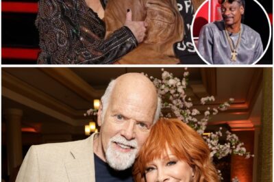 Reba McEntire‘s sitcom Happy’s Place films not too far from where The Voice’s studio sits, so it makes sense that her fiancé and co-star, Rex Linn, would accompany Coach McEntire across the lot. In fact, eagle-eyed viewers of the first episode of the Battle rounds of The Voice Season 28 may have noticed that between duets, Linn walked behind McEntire while she was chatting to the camera.Country music memorabilia
