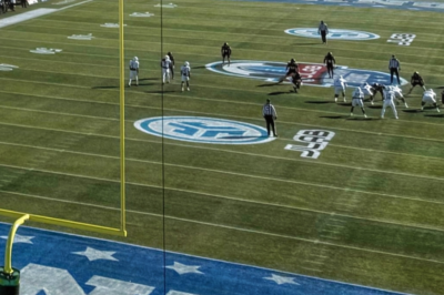 A college bowl game so empty, the popcorn vendor was the loudest fan in the stadium. These photos are brutally embarrassing.