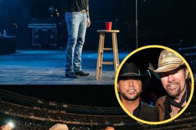 The microphone stand center stage was empty. A single red solo cup sat on the stool next to it. Jason Aldean walked out, but he didn’t pick up his  guitar. He just stood there, looking at that empty spot. The opening chords of “Should’ve Been a Cowboy” began to play, but nobody sang. The crowd was confused for a heartbeat. Then, they understood. 50,000 people started singing. They took the verse. They took the chorus. They sang for the man who couldn’t be there. Jason didn’t sing a note. He just lifted that cup towards the sky. In the VIP section, grown men in cowboy hats were openly weeping.