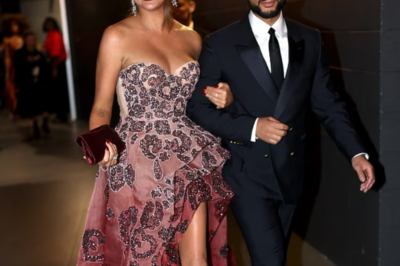 Chrissy Teigen dazzles in a strapless gown with daring thigh-high slit as she enjoys date night with husband John Legend at the Grammys after revealing she’s sober again