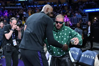 NBA fans reacted with mixed opinions to LeBron James shaking hands with Justin Bieber on the day the LA Lakers suffered a heartbreaking defeat.