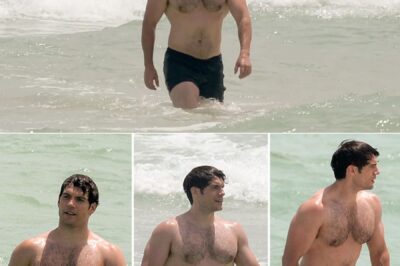 Superman hunk Henry Cavill shows off his super beach bod as he emerges from the sea