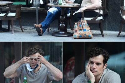 Henry Cavill puts on an animated display as he tucks into wine and pasta while enjoying al-fresco lunch with a female friend