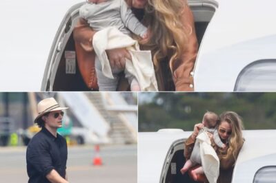 Henry Cavill looks very dapper as he jets into Sydney with fiancée Natalie Viscuso and rarely-seen baby