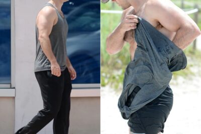 Superman hunk Henry Cavill shows off his super beach bod as he emerges from the sea